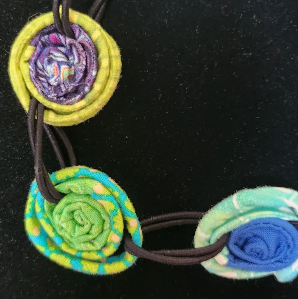 Multi colored coiled fabric necklace